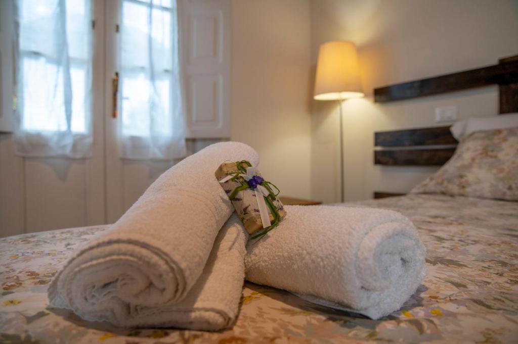Postel nebo postele na pokoji v ubytování Corte Volpe Home