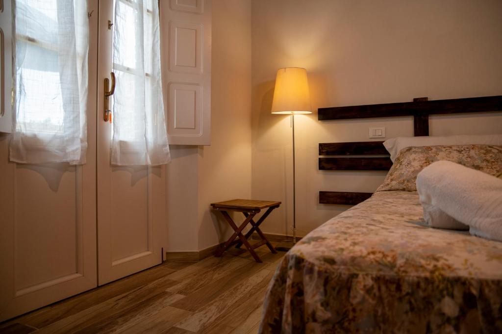 Postel nebo postele na pokoji v ubytování Corte Volpe Home