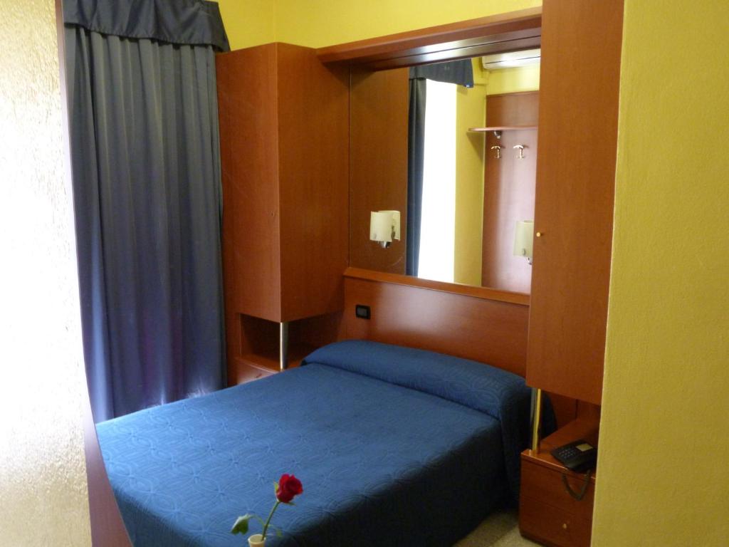 Postel nebo postele na pokoji v ubytování Hotel Aurora