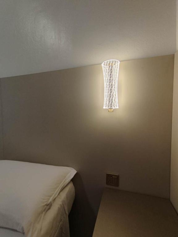 Postel nebo postele na pokoji v ubytování Hotel Mondial