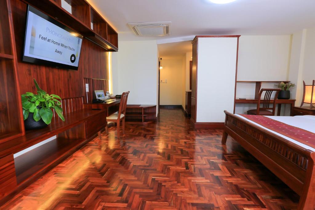 a hotel room with a bed and a desk at Phongsavath Boutique Hotel in Vientiane