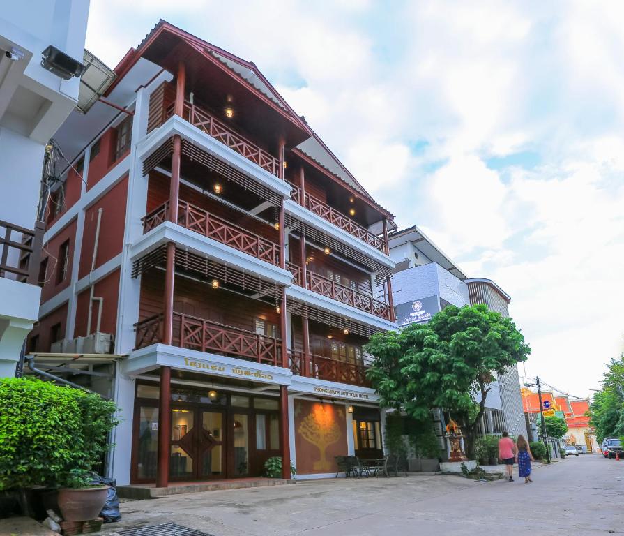 a building with balconies on the side of it at Phongsavath Boutique Hotel in Vientiane