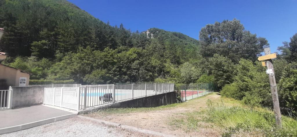 a bridge over a skate park with a mountain in the background at T2 au cœur de la nature de Digne in Digne-les-Bains