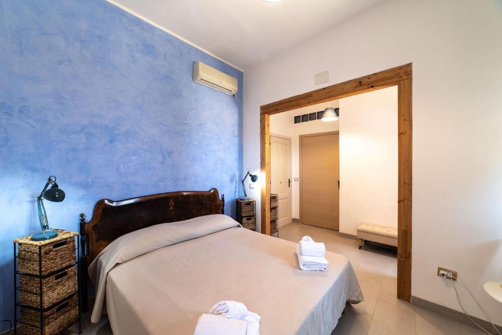 Łóżko lub łóżka w pokoju w obiekcie Borgo Marino Plemmirio