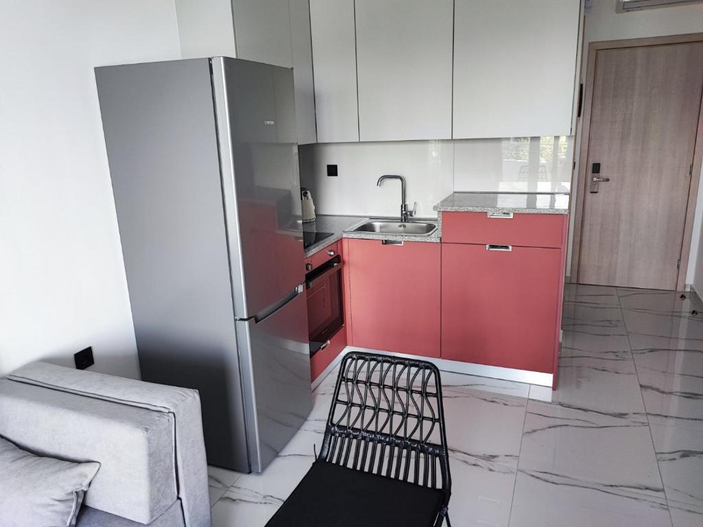 Kuchyň nebo kuchyňský kout v ubytování suite apartment Αdonis