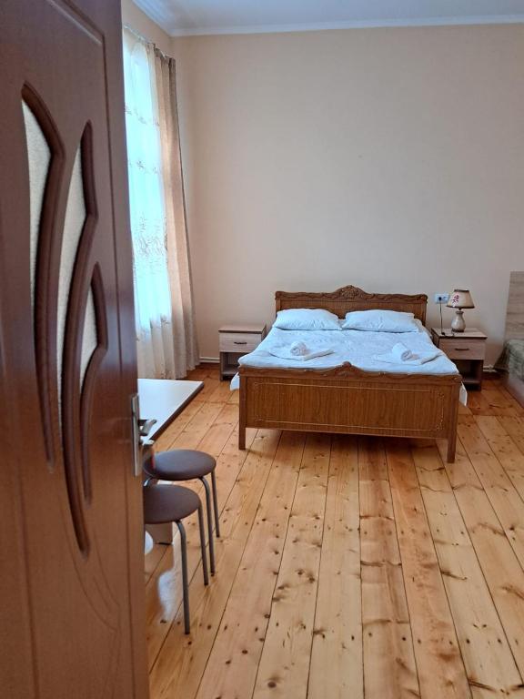 Postel nebo postele na pokoji v ubytování Guest House David's B&B