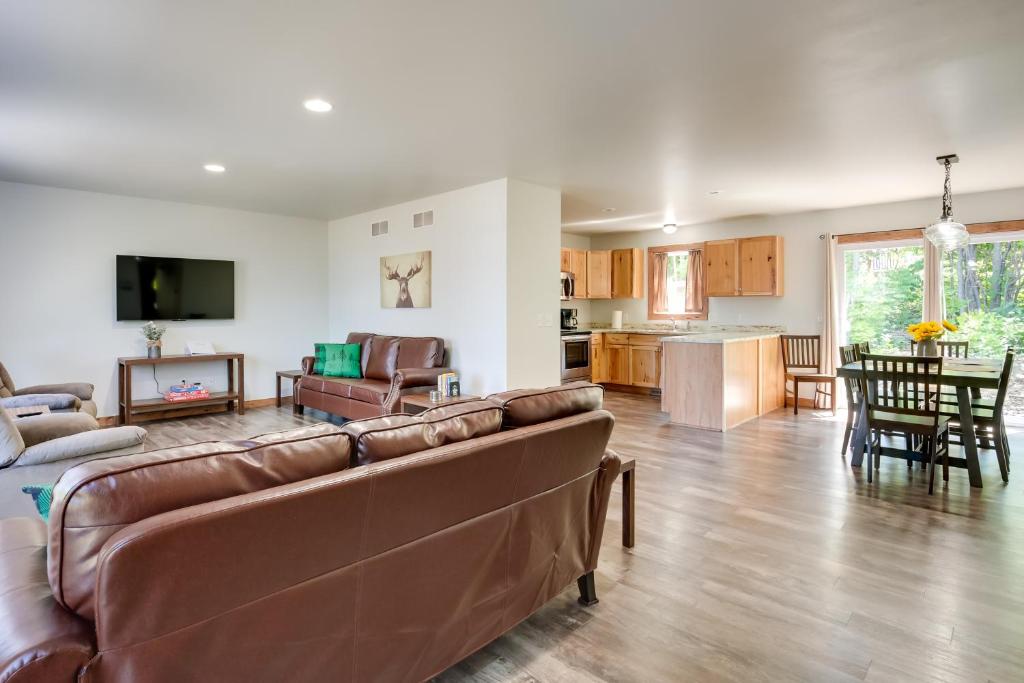 A seating area at Wooded Hancock Home Near Ski and Snowmobile Trails!