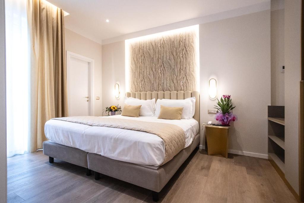 Postel nebo postele na pokoji v ubytování Hotel Helios
