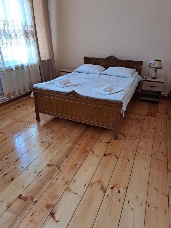 Postel nebo postele na pokoji v ubytování Guest House David's B&B
