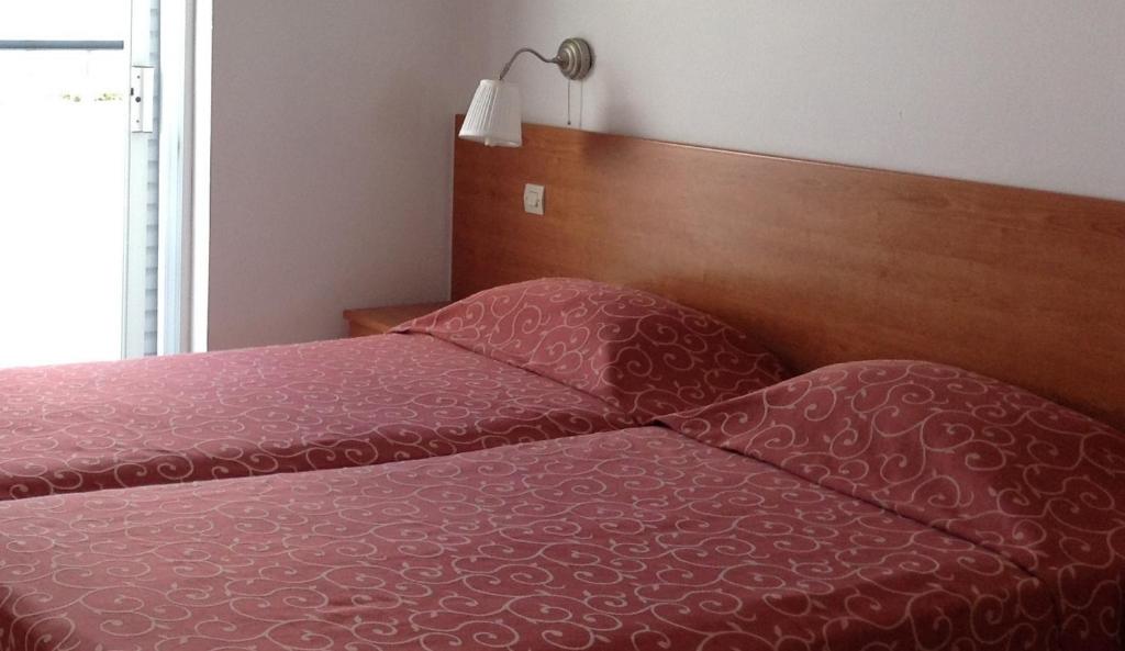 Posteľ alebo postele v izbe v ubytovaní Pylea Beach Hotel