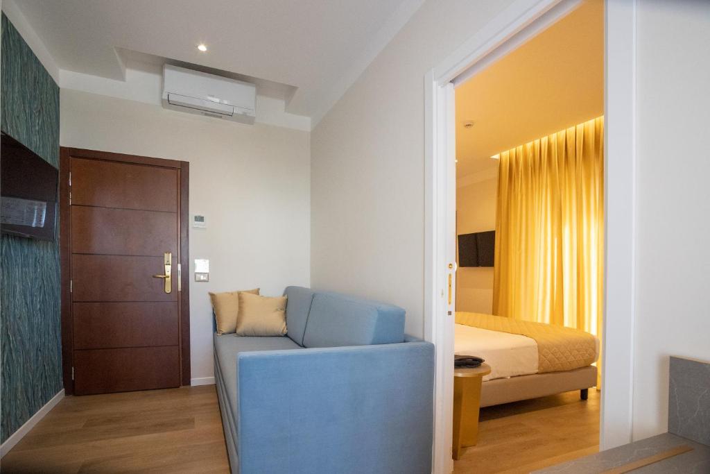 Postel nebo postele na pokoji v ubytování Hotel Helios