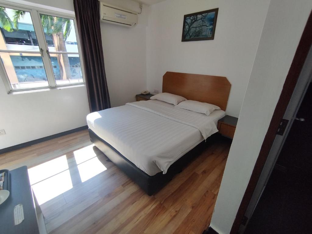 Postel nebo postele na pokoji v ubytování Marine Bay Hotel