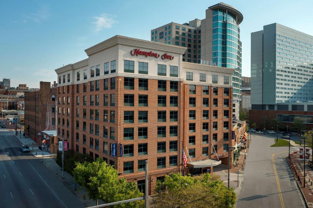 a building with a sign on the top of it at Hampton Inn Baltimore-Downtown-Convention Center in Baltimore