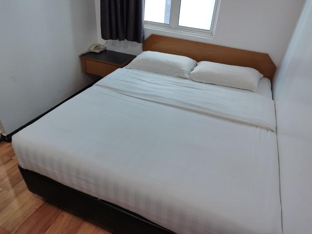 Postel nebo postele na pokoji v ubytování Marine Bay Hotel