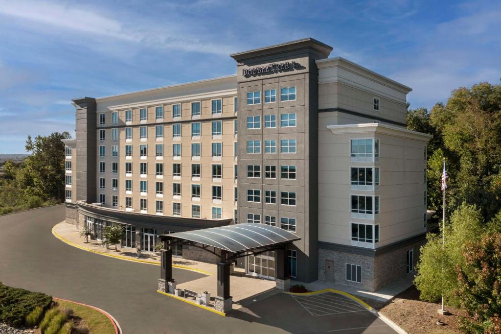 a rendering of a hotel building with a bus stop at Doubletree by Hilton Chattanooga Hamilton Place in Chattanooga