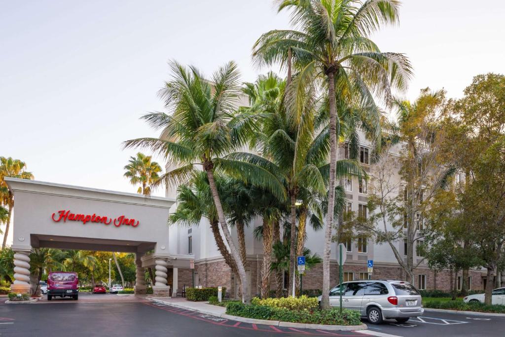 a walmart building with palm trees in the parking lot at Hampton Inn Fort Lauderdale Plantation in Plantation