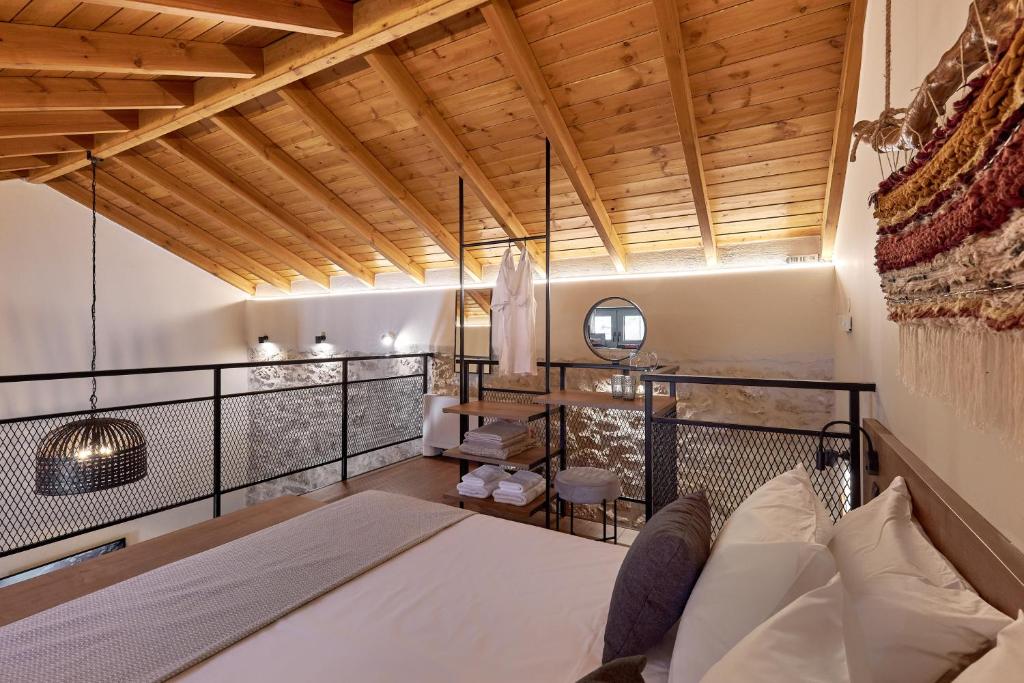 Postel nebo postele na pokoji v ubytování Vin Dimora Suites