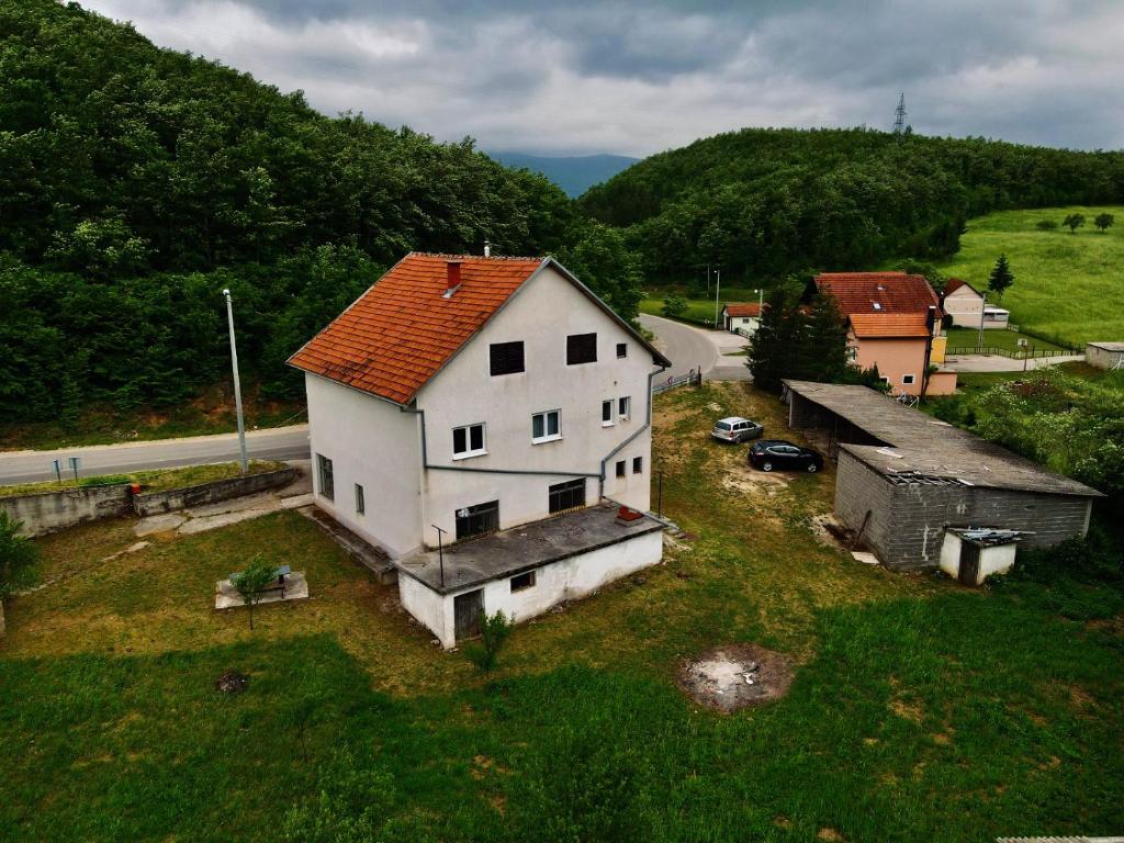 an aerial view of a white house in a field at Kuća za odmor Bilić 