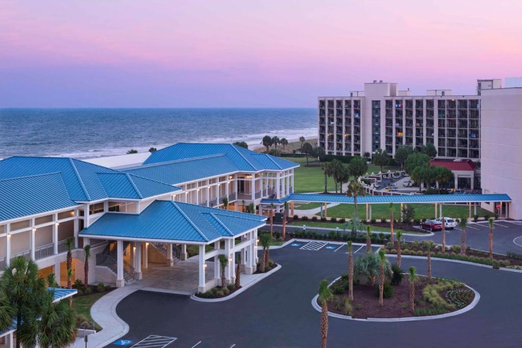 an aerial view of a resort with the ocean in the background at DoubleTree Resort by Hilton Myrtle Beach Oceanfront in Myrtle Beach