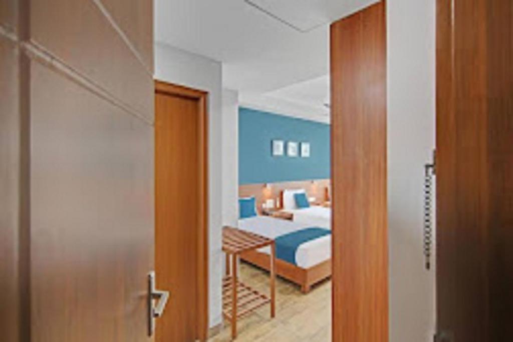 Postel nebo postele na pokoji v ubytování DSquare omr BY K Hotels
