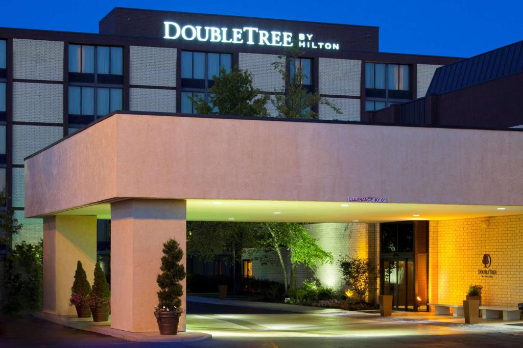 a building with a building with a sign on it at DoubleTree by Hilton Columbus/Worthington in Worthington
