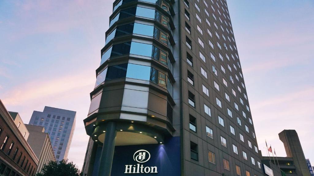 a tall building with the hilton sign on it at Hilton Boston Back Bay in Boston