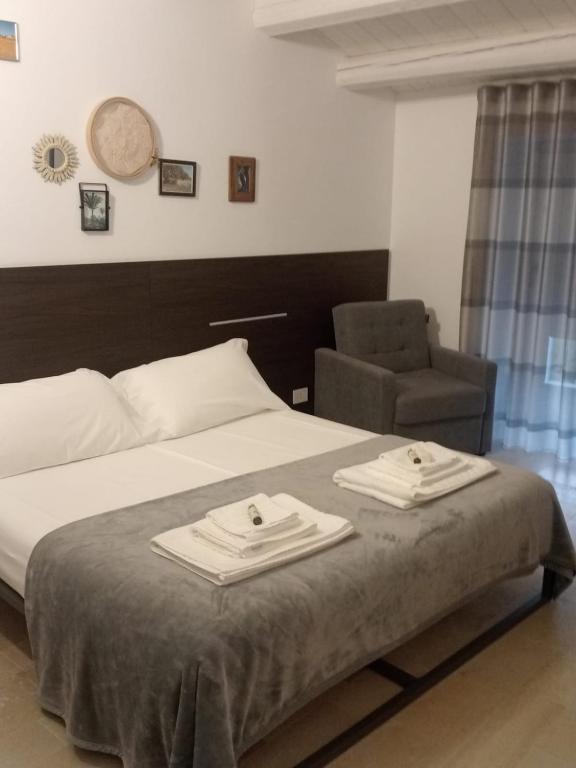 Postel nebo postele na pokoji v ubytování IBLA ROOMS