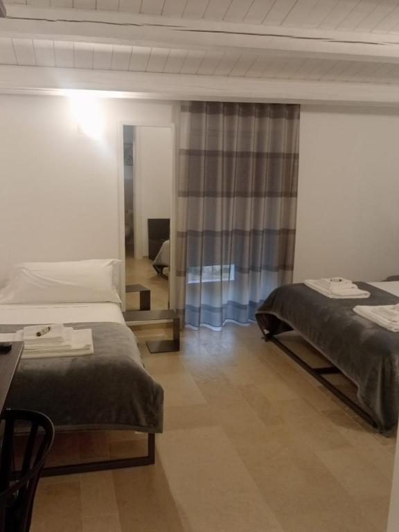 Postel nebo postele na pokoji v ubytování IBLA ROOMS