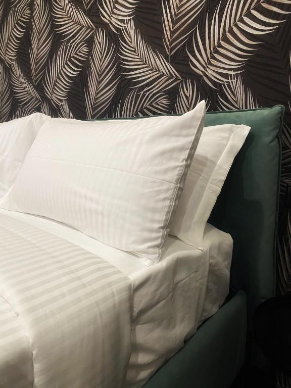 Postel nebo postele na pokoji v ubytování Le Colonne B&b