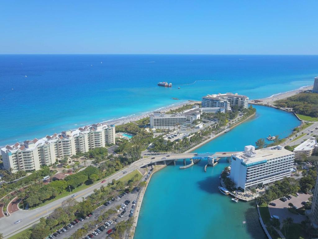 an aerial view of a city with a bridge over the water at Waterstone Resort & Marina Boca Raton, Curio Collection by Hilton in Boca Raton
