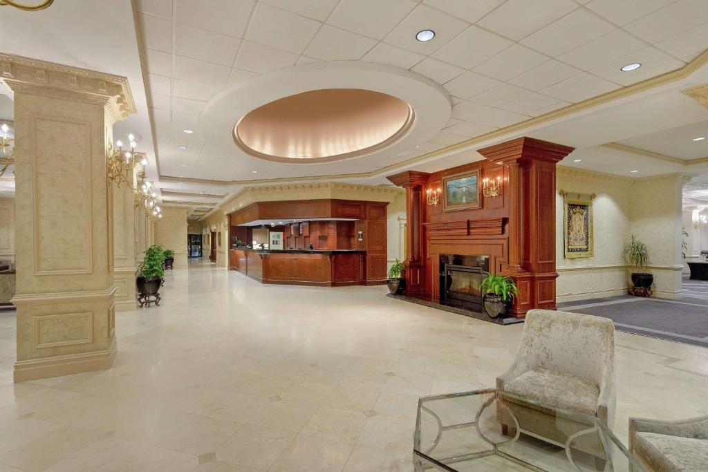 a large lobby with a chair and a table at Hilton Jackson in Jackson