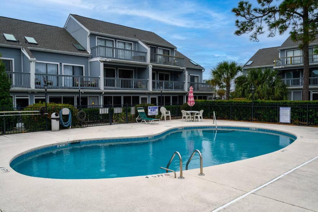 The swimming pool at or close to Poolside Condo in Surfside Beach