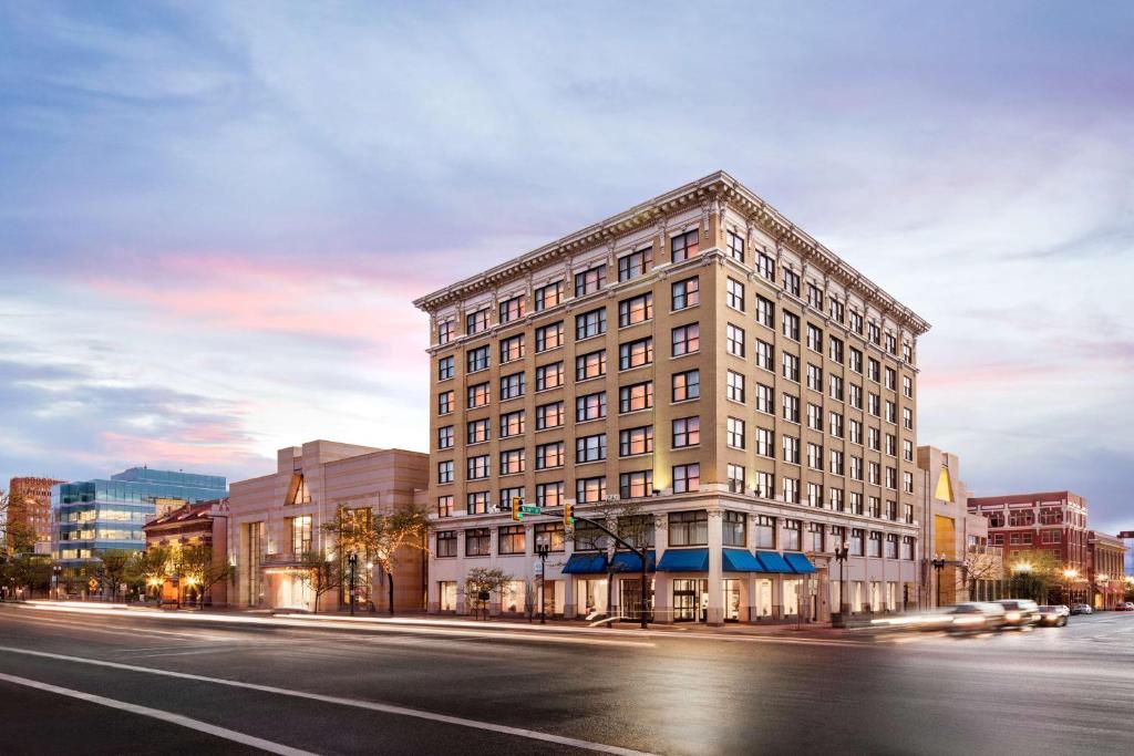 a tall building on a city street with a street at Hampton Inn and Suites Ogden in Ogden