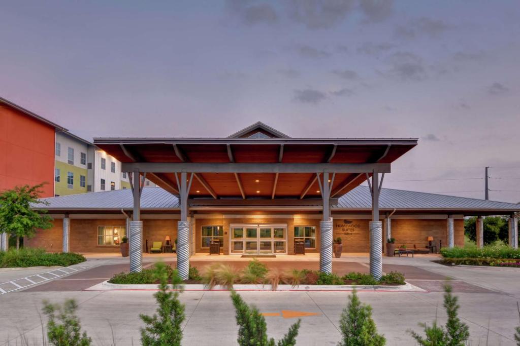 a large building with a large roof at Homewood Suites TechRidge Parmer @ I-35 in Austin