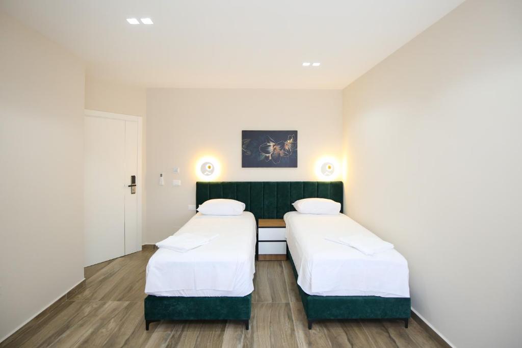 Voodi või voodid majutusasutuse Queen Apartmets Vlore toas
