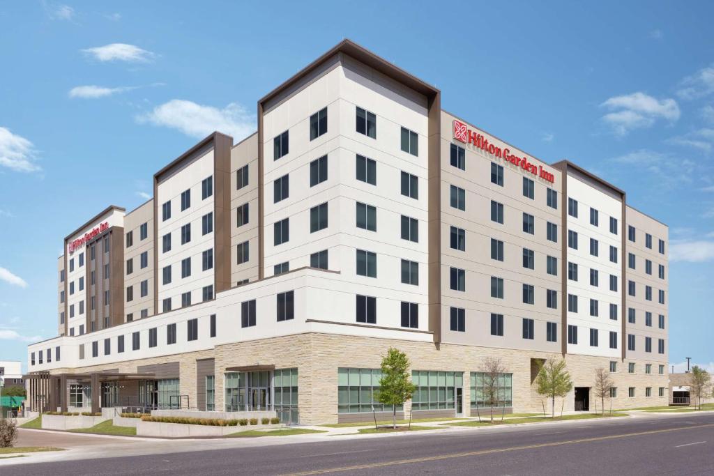 a rendering of the front of the building at Hilton Garden Inn Austin North-Near the Domain, TX in Austin