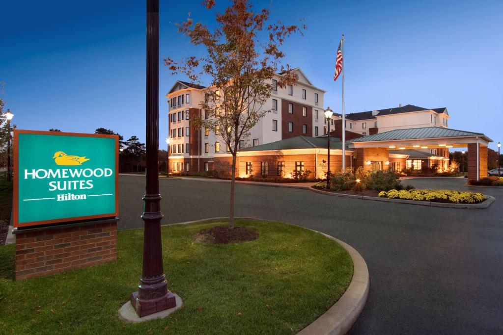 a sign in front of a building with a hotel at Homewood Suites by Hilton Newtown - Langhorne, PA in Newtown