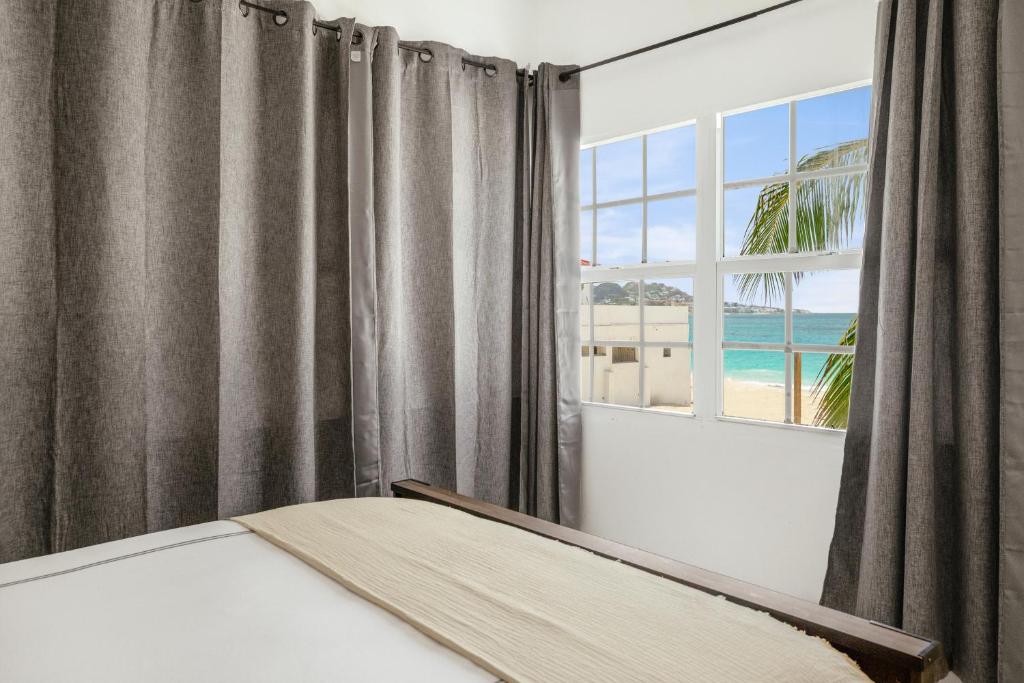 Postel nebo postele na pokoji v ubytování CocoVaa Beach Boutique Hotel