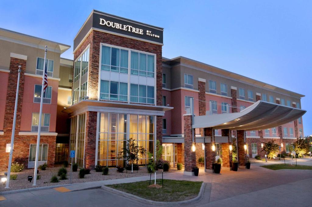 a rendering of the front of a building at DoubleTree by Hilton West Fargo Sanford Medical Center Area in Fargo