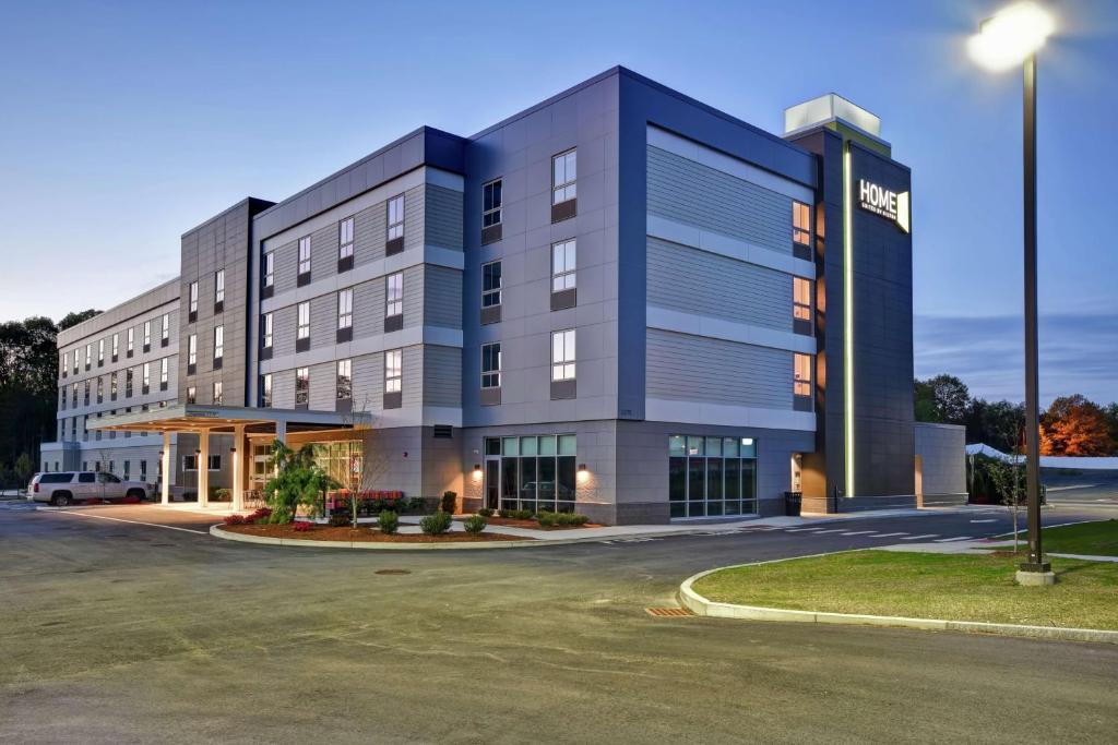 a rendering of the front of a hotel at Home2 Suites By Hilton Walpole Foxborough in Foxborough