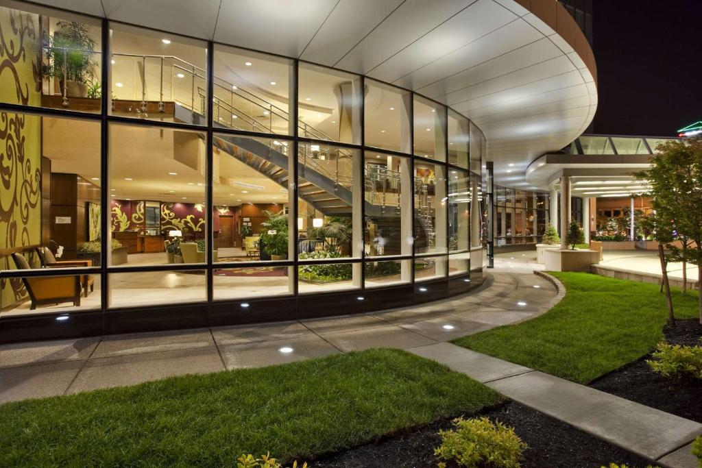 a large building with a lot of windows at Embassy Suites Buffalo in Buffalo