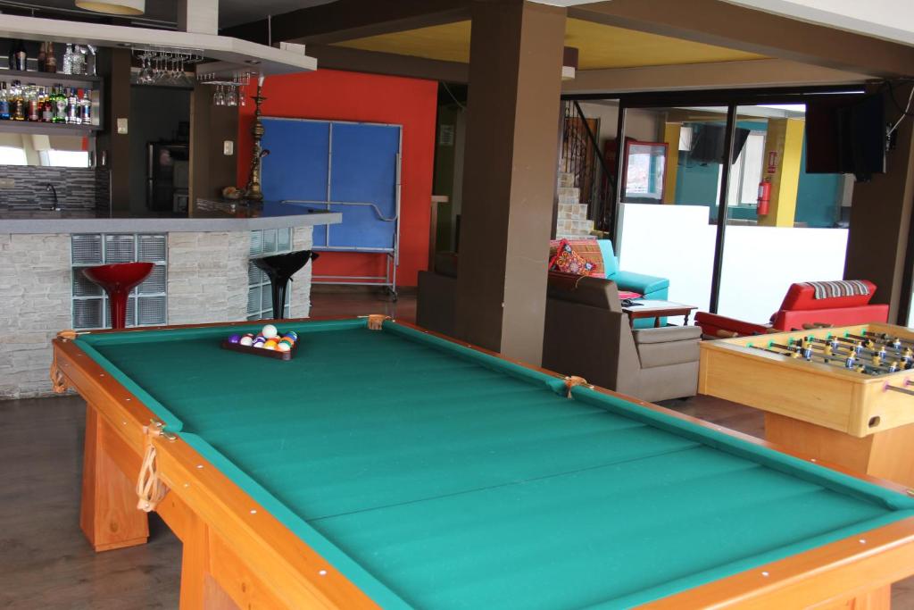 a living room with a pool table in it at Cuscopackers Hostels in Cusco