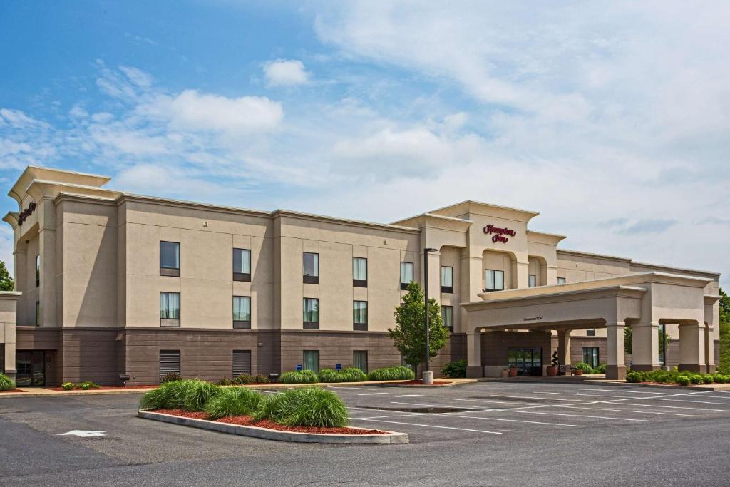 a large office building with a parking lot at Hampton Inn Clearfield in Clearfield