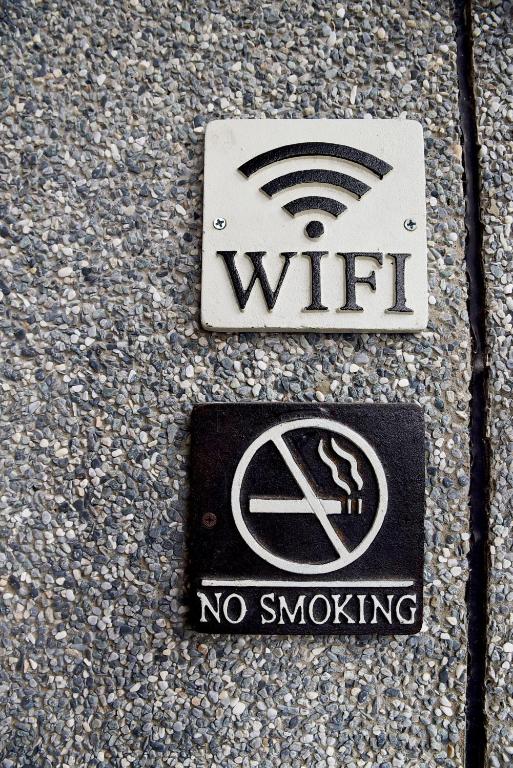 a sign on the ground that says wifi and no smoking at Wei Sen House in Hualien City