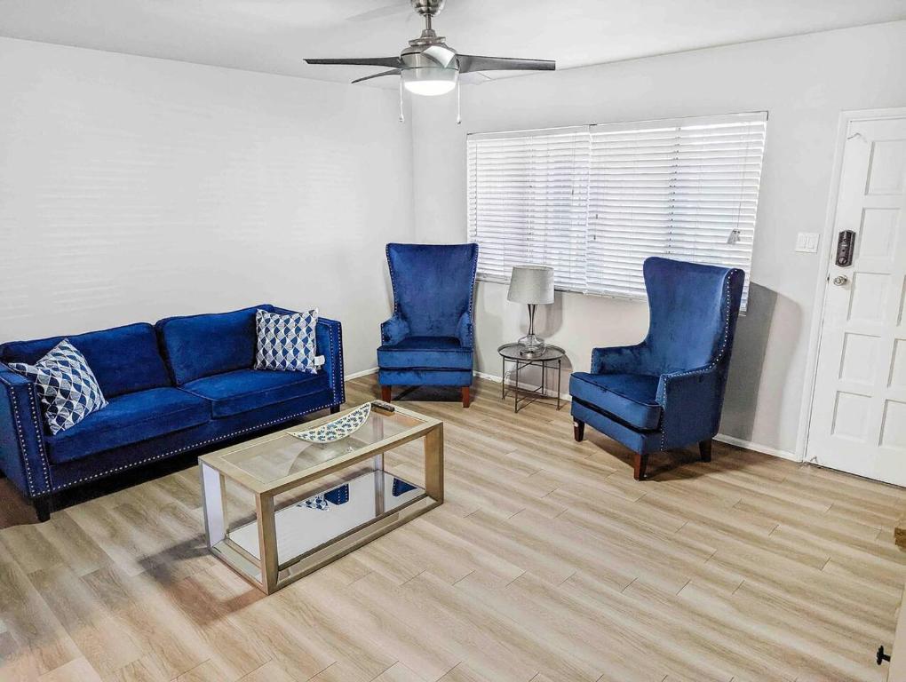 a living room with two blue couches and a table at Central Scottsdale 2BR in a Quiet Area! in Scottsdale