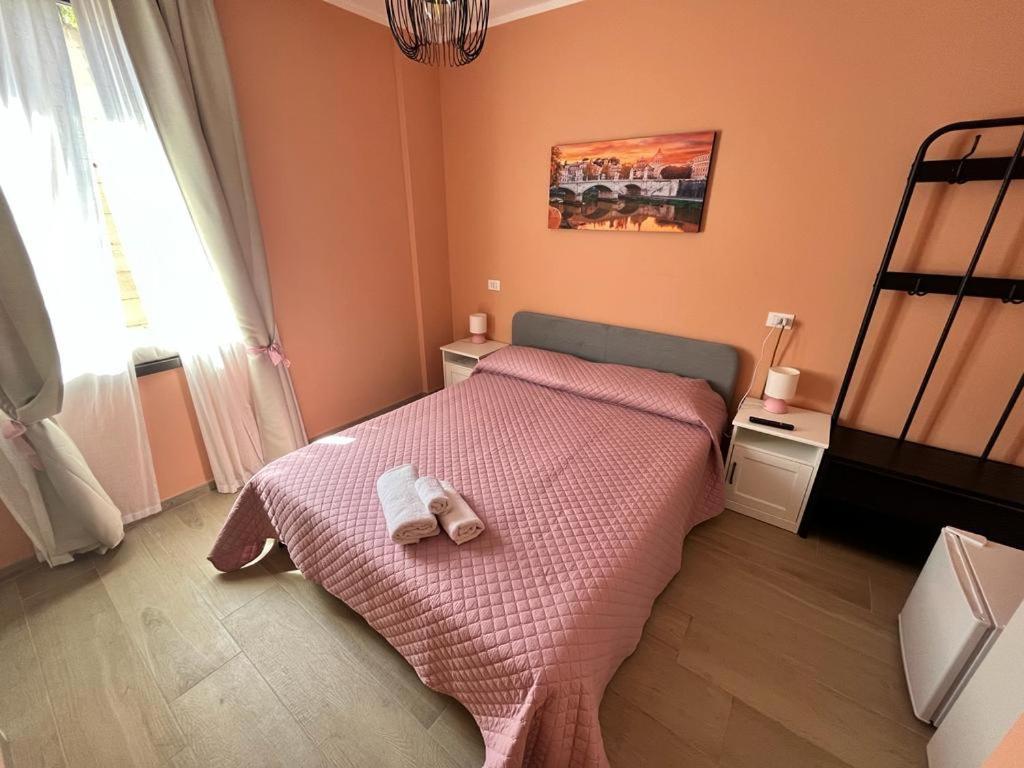 Postel nebo postele na pokoji v ubytování Affittacamere L'Aurora