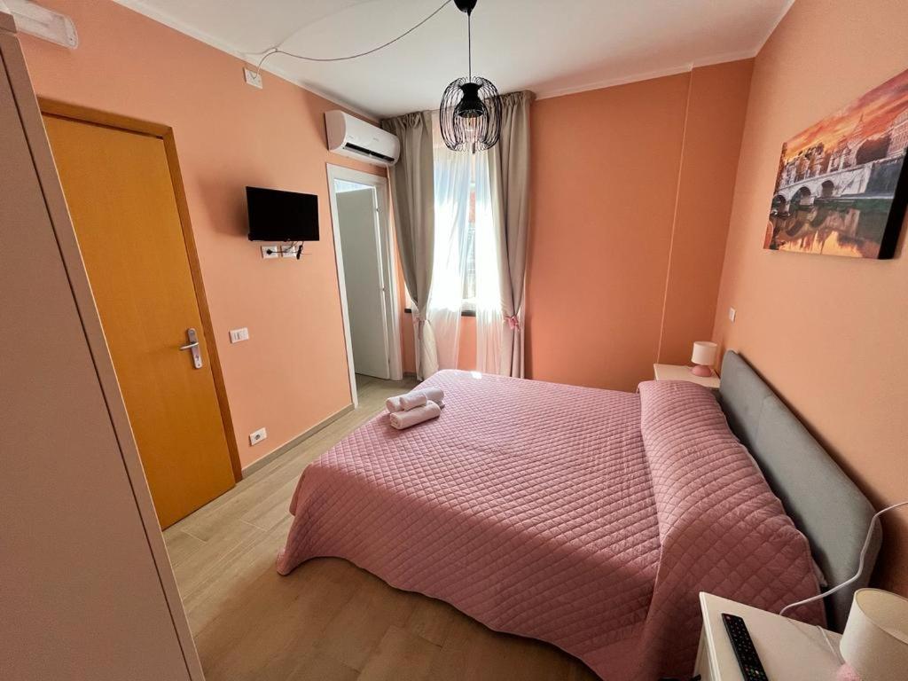 Postel nebo postele na pokoji v ubytování Affittacamere L'Aurora