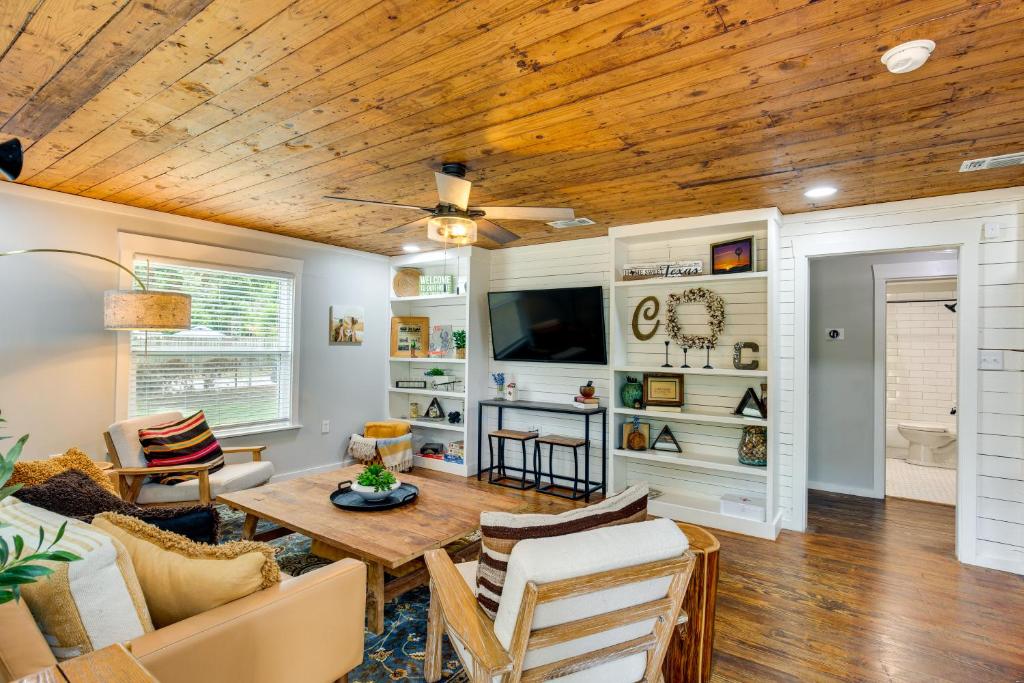 a living room with a wooden ceiling at Lindale Vacation Rental with Deck and Grill! in Lindale