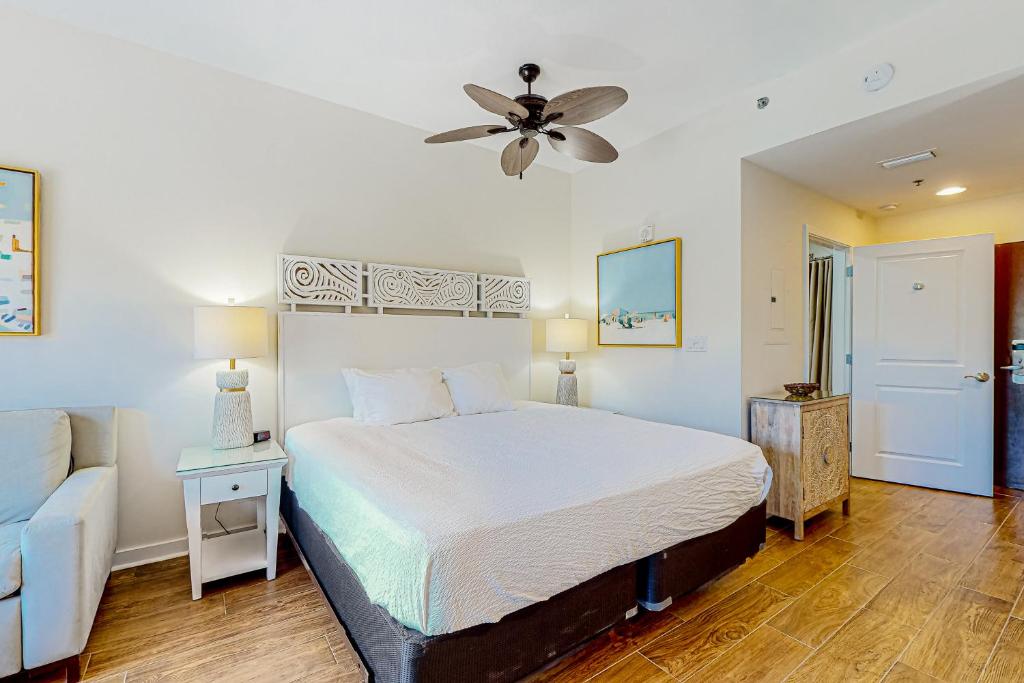 a bedroom with a bed and a ceiling fan at Luau, Unit 6108 in Destin