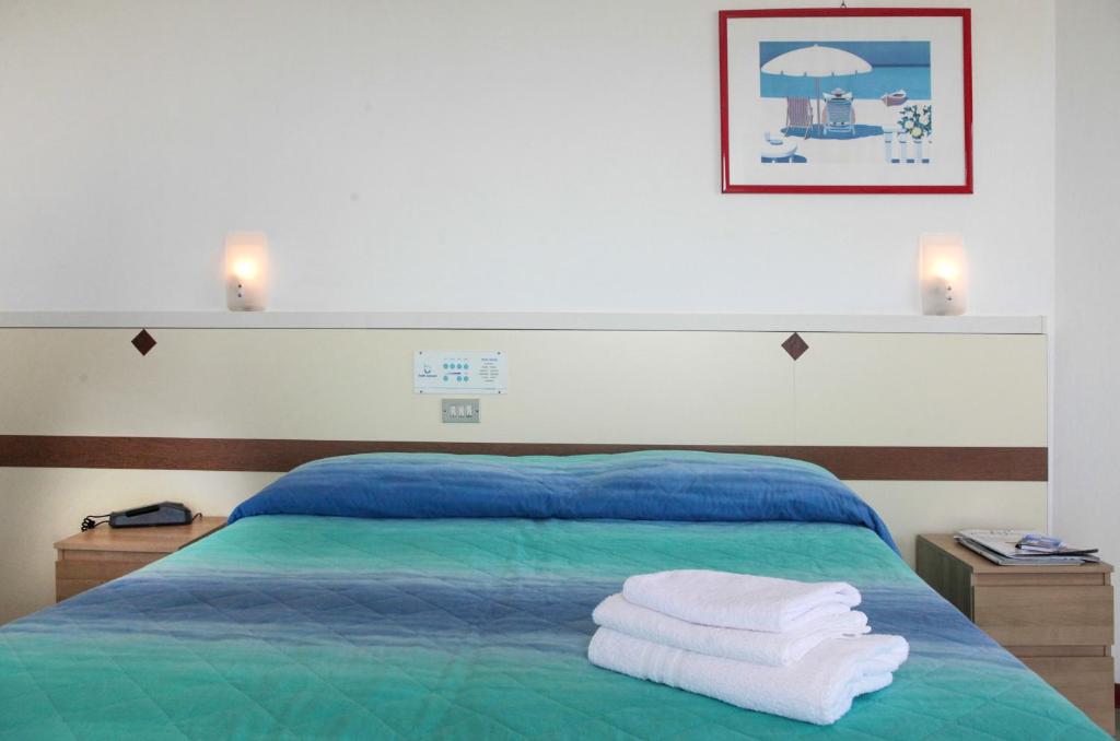 Postel nebo postele na pokoji v ubytování Hotel Concord